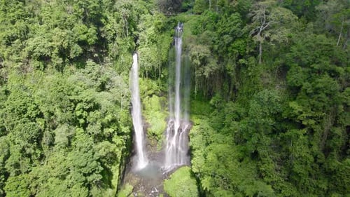 Waterfall aerial close-up view in a jungle in Bali, Indonesia, Sekumpul waterfall drone view.