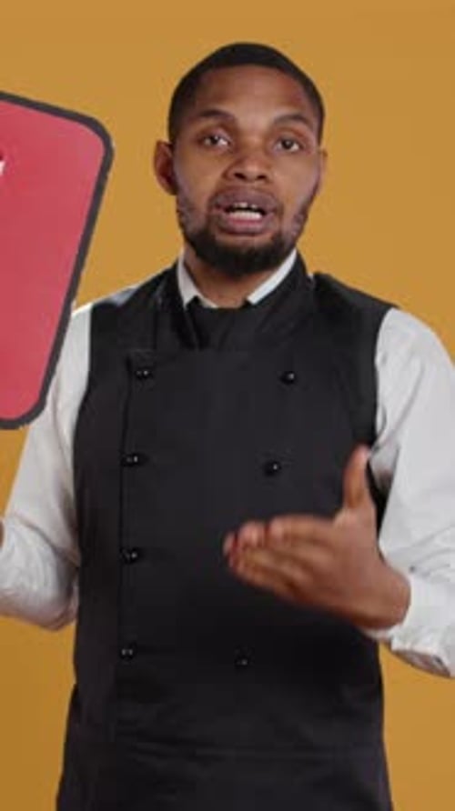 Vertical Video Professional Waiter Showing a Message to Vote on Speech Bubble