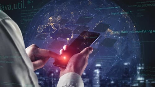 Hands holding smartphone with glowing world map and coding text overlay, illustrating technology com