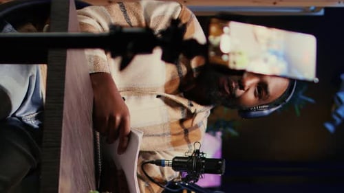 Podcaster Records Episode in Cozy Home Studio