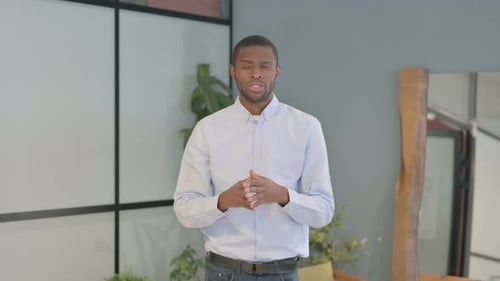 Man Explaining a Concept Indoors