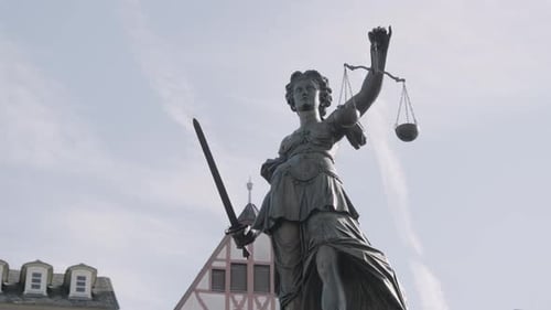 Static shot of Justitia Statue at römer place, at daylight, closeup with clear sky, frankfurt, hesse