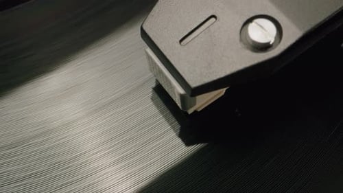 Record Player Needle on Rotating Vinyl Record