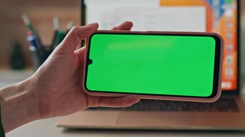 Office Worker Watching Chroma Key Cellphone Social Media at Work Desk Close Up