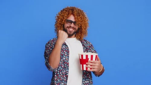Excited Man in 3D Glasses Eating Popcorn Watching Interesting Tv Serial Sport Game Cinema Film