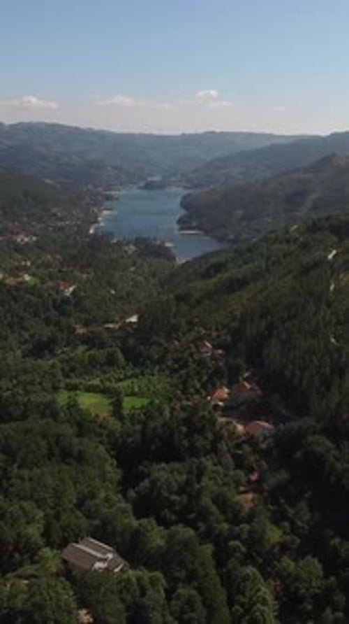 Vertical Video of Mountainous Landscape with River and Forest