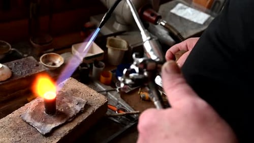Gold Wedding Ring Making By Goldsmith Isolated Jeweler Melts Gold in Liquid State in Crucible