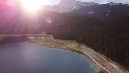Amazing aerial drone view of Crno Jezero or Black lake, pine forest and cliffs in Durmitor national