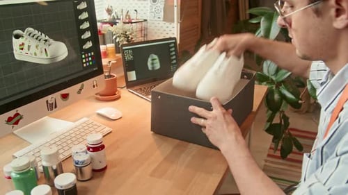 Young Adult Opening Box of White Sneakers