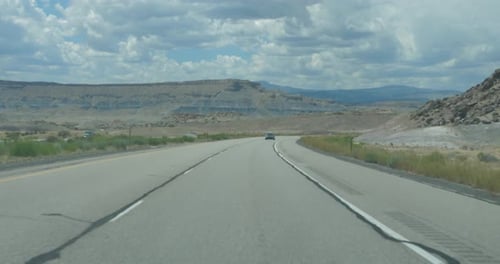 Driving on desert road with camera in car in Nevada. 4K
