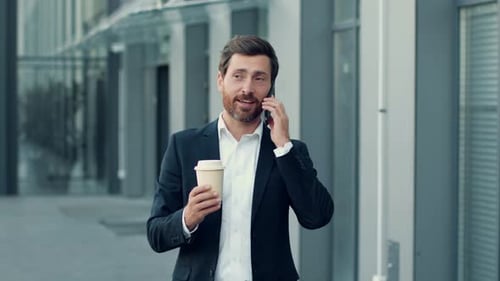 Professional Man Talking on Phone with Coffee Outdoors