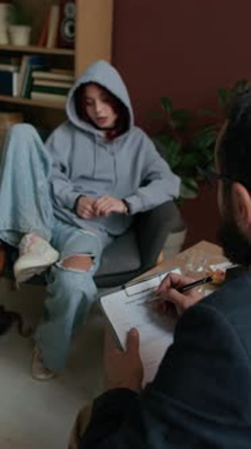 Young Woman in Therapy Session with Therapist