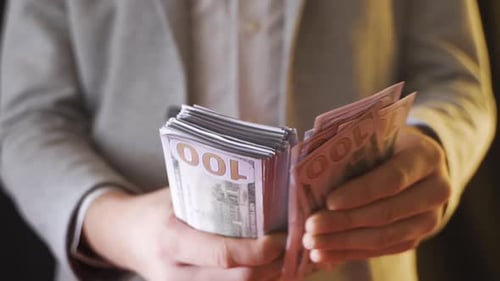 Hands Counting Money US Hundred Dollar Bills