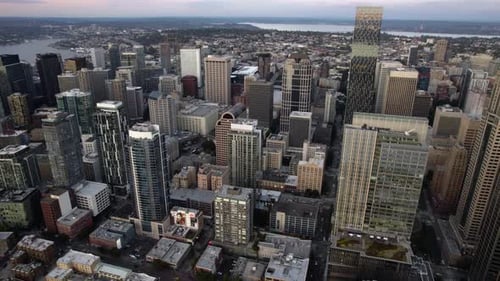 Aerial view overlooking the cityscape of Seattle, sunrise in northwest USA - panoramic, drone shot