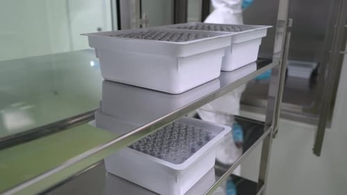 Pharmaceutical Manufacturing Technician Working in Laboratory Production Equipment at Pharmacy