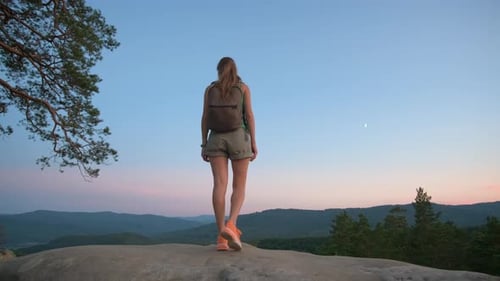 Sportive Woman Walking Alone on Hillside Trail Female Hiker Enjoying View of Evening Nature From