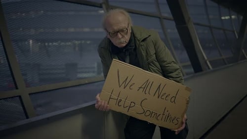 Elderly Homeless Man Suffering From Poverty Looking for Help at Train Station