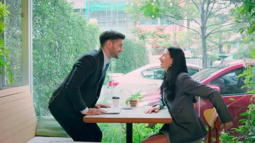 Professional Man and Woman Shake Hands After Meeting