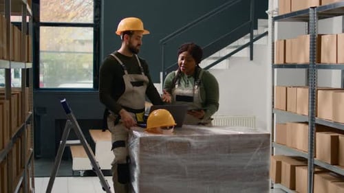 Warehouse Workers Monitoring Inventory