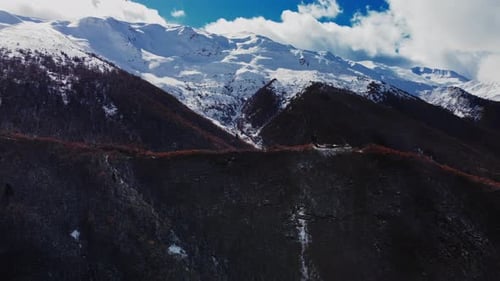Breathtaking Mountain Ridge with Peaks Covered By Snow Filmed By Drone in Georgia