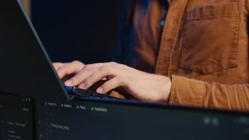 Programmer Concentrating on Writing Binary Code Scripts on Laptop Close Up