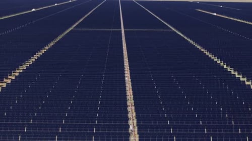 Aerial View of Vast Solar Panel Array in Desert
