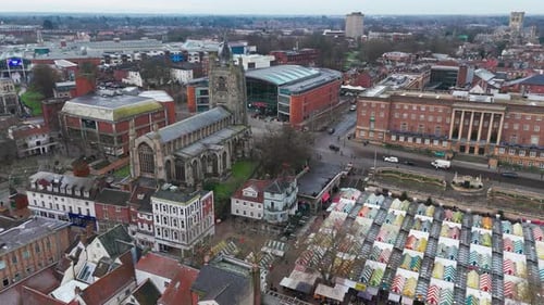 Aerial view of Norwich showing historic church, marketplace, and urban architecture
