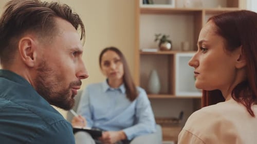 Tense Couple Talking During Counseling Session
