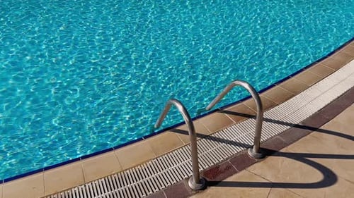 Swimming Pool Water, Sunbeds in Slow Motion
