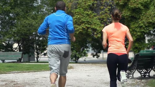 Sportive Couple Jogging in City Park, Super 240