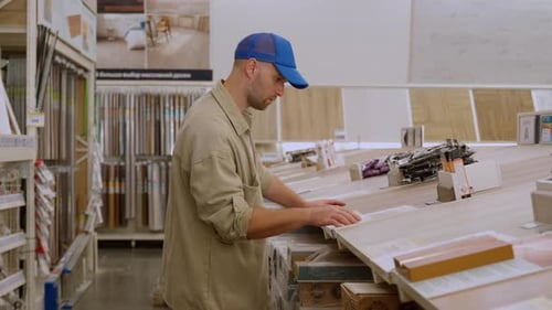 Man Shopping for Hardwood Flooring at Retail Store