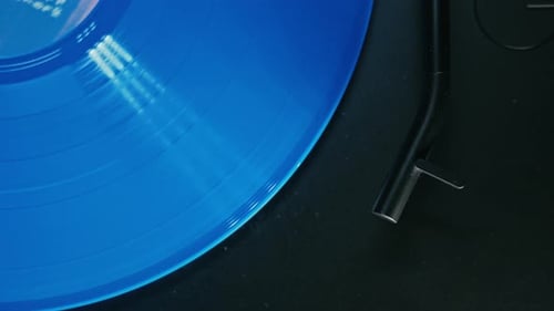 Vibrant Blue Vinyl Record Spinning on Turntable
