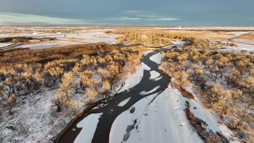 South Platte River flows in eastern Colorado plains and farmland near Milliken,