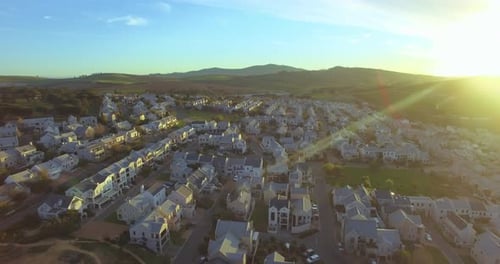 Real estate, sunrise in countryside with houses and drone, community in nature for agriculture