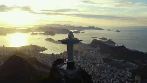 Panoramic Drone View Capturing the Silhouette of the Jesus Statue at Sunset