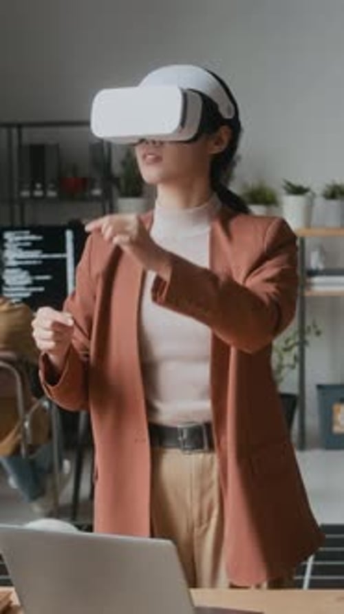 Woman in VR Headset Testing Augmented Reality Software in Office