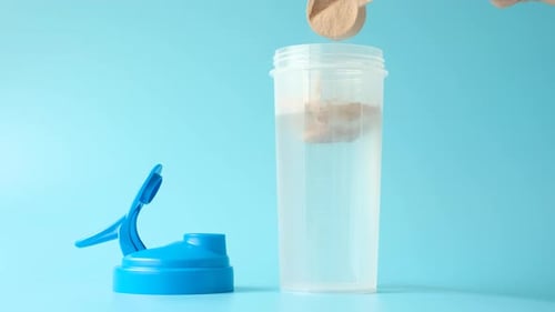 Adding Protein Powder to Shaker with Water