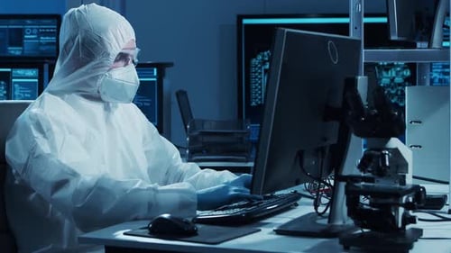 Microelectronics Engineer Works in a Modern Scientific Laboratory on Computing Systems and