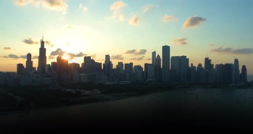 Chicago Illinois skyline radiates golden hour beauty over lake Michigan