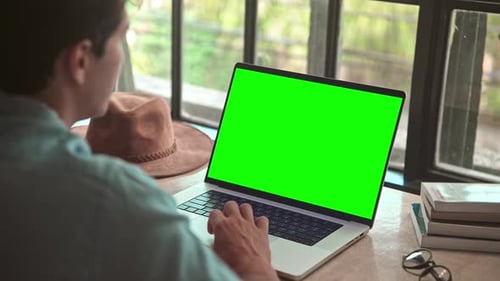 Business Man Working on Laptop Computer with Green Screen and Typing on Keyboard