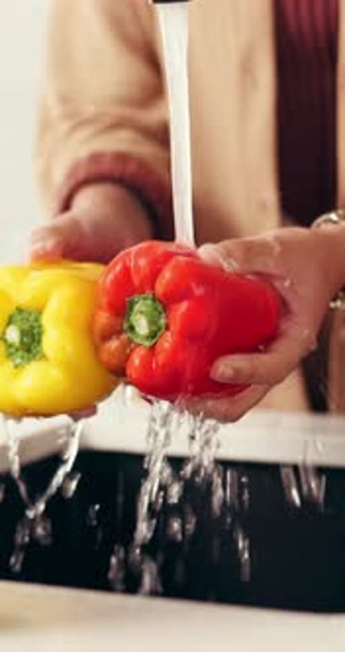 Hands, cleaning and vegetables in kitchen with water for meal prep, fresh food