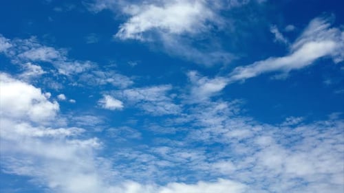 Clouds Moving Across Vast Blue Daytime Sky