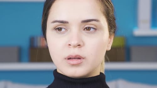 Woman Looks Around With Darting Eyes