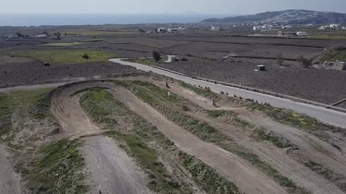 Dirt Bike on a Track in Rural Landscape
