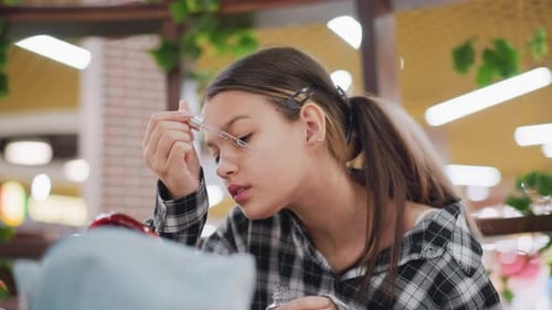 Teen Applies Beauty Serum Indoors