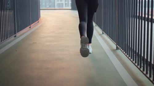 B roll - Closeup sports running shoes or city bridge workout in sunset, Fitness woman running