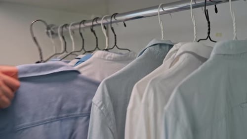 Clean Closet with Blue and White Shirts