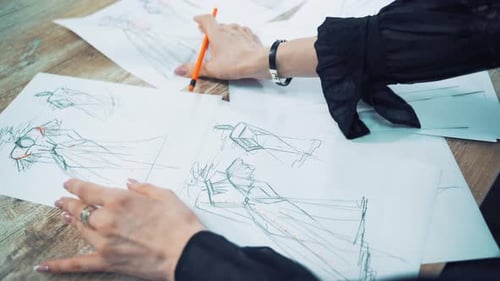 Clothing Designer Sketching Fashion Design