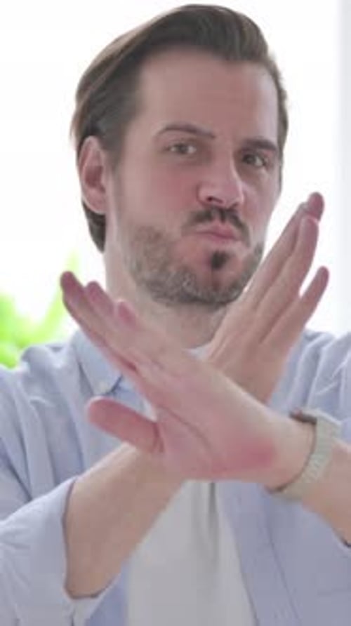 Portrait of Man Showing No Sign Arms Crossed, Vertical Video
