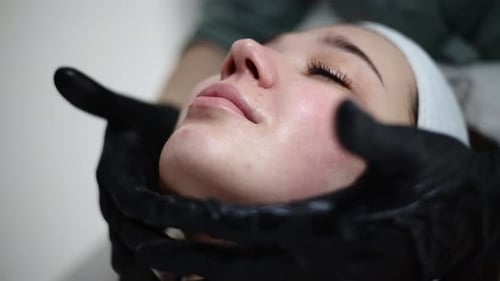Woman Receiving Facial Peeling Skin Care in Cosmetology Beauty Spa Salon